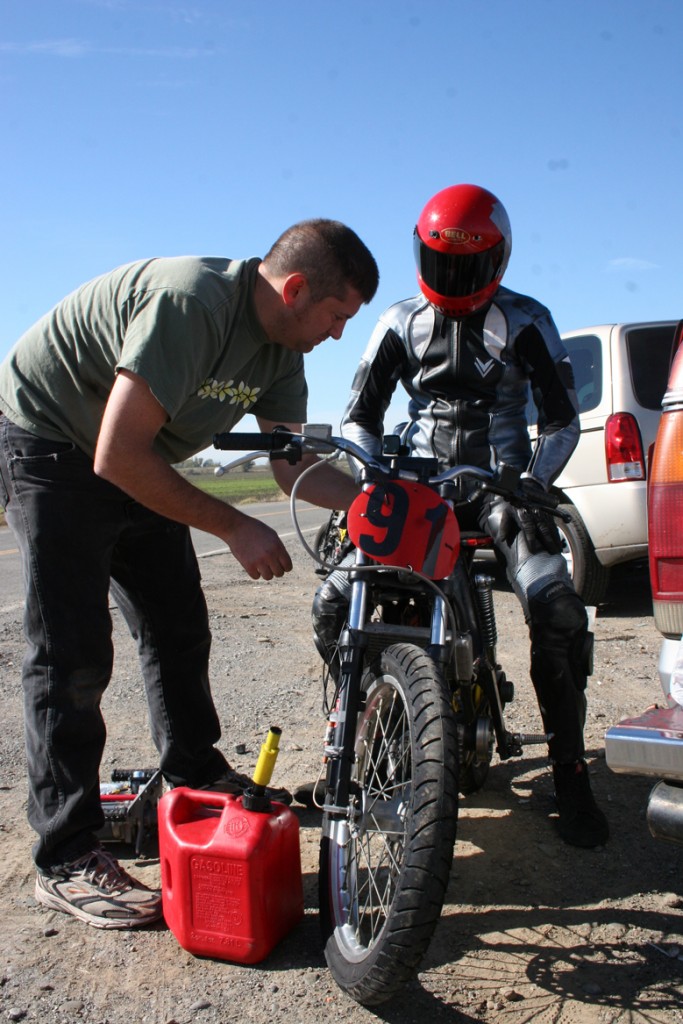 Tony gassing up the bike for road speed test with Terry Dean Cain as driver.